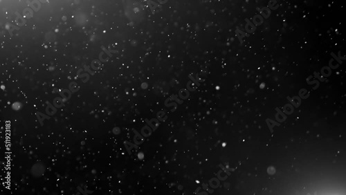 Particles on black background. 4k abstract Particles footage. particles floating in the air. photo