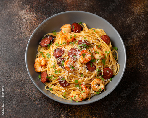 Prawn and chorizo pasta with cheese and herbs photo