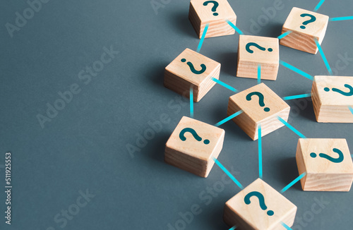 Blocks with questions connected in a network. Lots of unknown facts. Curiosity, exploration. Questions and problem solving. Technologies, extraction of knowledge and hidden information. photo
