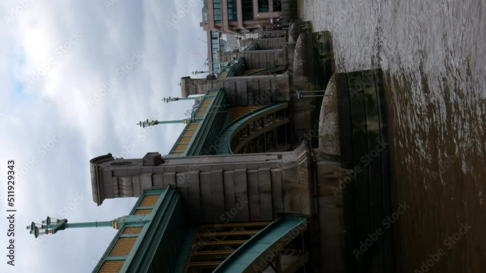 A vertical still shot of the beautiful Thames bridge in London. A vertical still shot of the beautiful Thames bridge in London.
