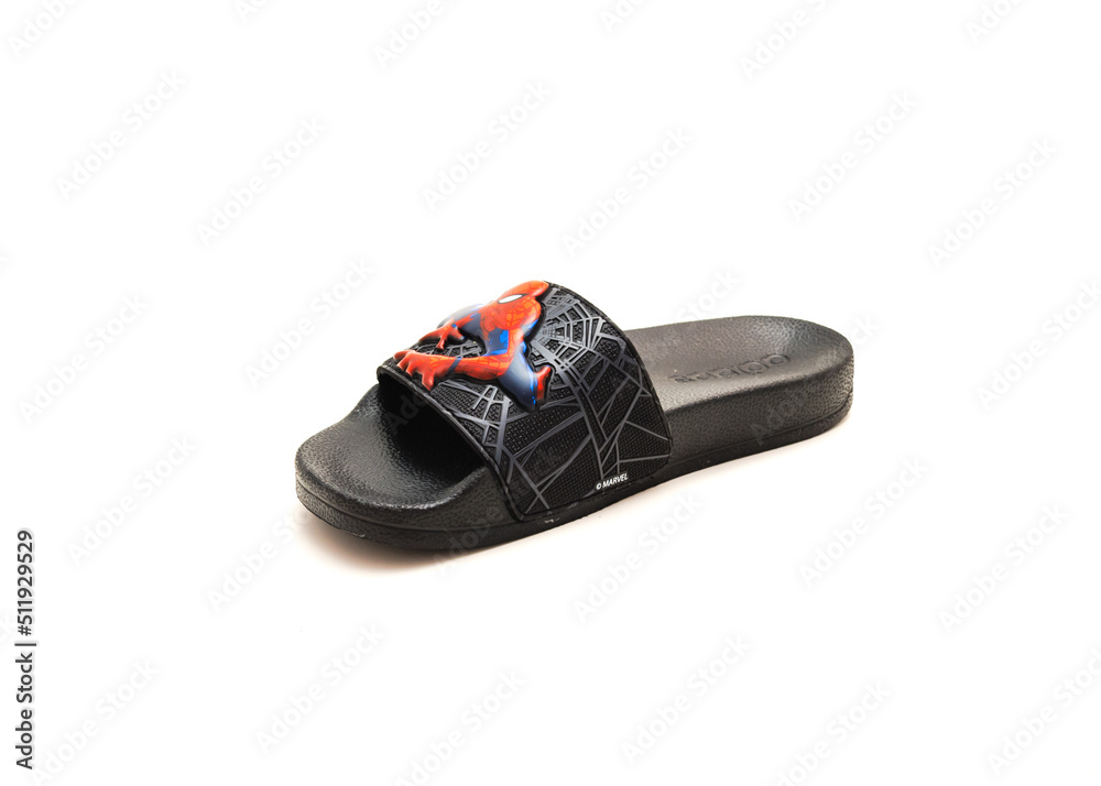 Obraz premium Single adilette shower slides sandal style with an open toe and print design of Spiderman from Adidas isolated on white background