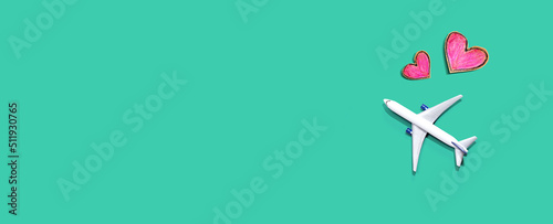 Flights booking and reservation theme with a toy airplane and hearts