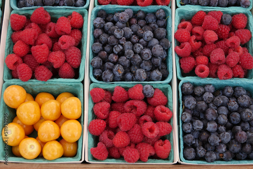 pints of fresh organic berries at the market