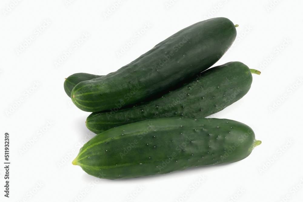 A pile of cucumbers isolated on white background. Close up view. A pile of cucumbers isolated on white background. Close up view.