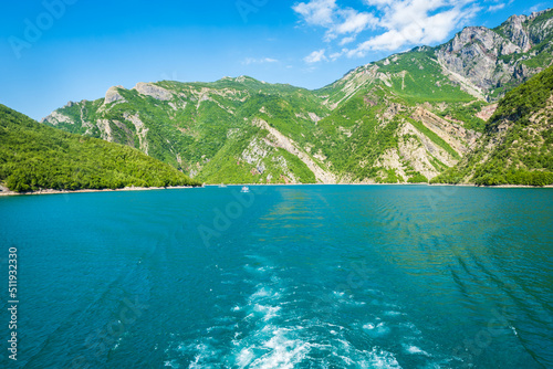 Komani Lake ferry cruise boat view near the town of Fierz, Albania. Komani Lake is a popular tourist destination in Albania.  photo