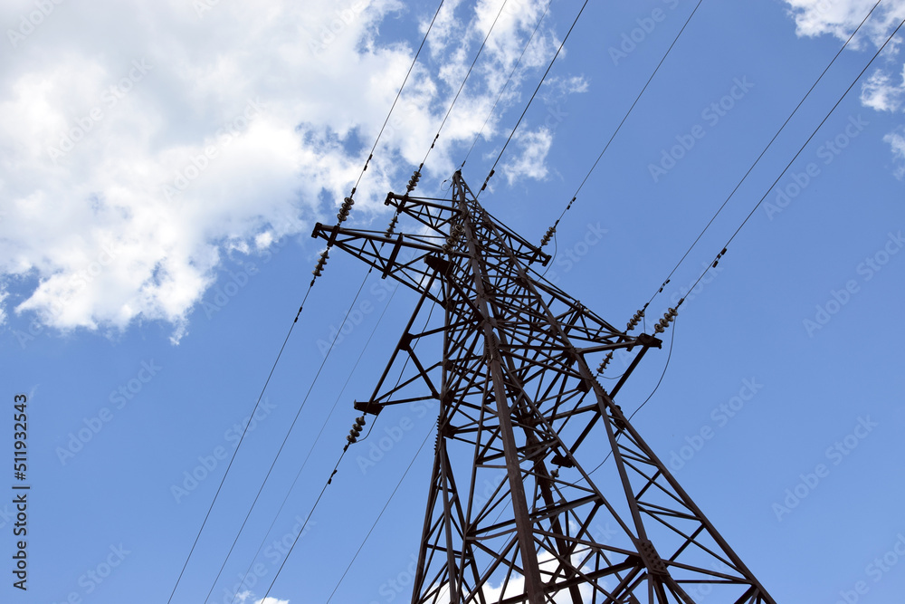 Electricity pylon, electrical transmission tower, against blue sky background. Electricity pylon, electrical transmission tower, against blue sky background.