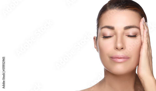 Beauty and Skincare Concept. Gorgeous brunette middle aged woman face with nude makeup on a flawless skin. Panorama banner with lateral white copyspace