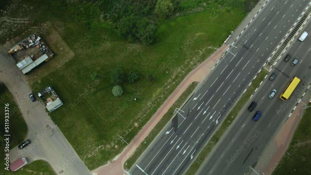 Crossroads of a large city highway. Near the park area with the river. Taken from above. Time lapse. Aerial photography. Crossroads of a large city highway. Near the park area with the river. Taken from above. Time lapse. Aerial photography.