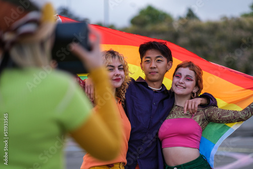 A group of friends taking a photo at the demonstration for lgtbi pride