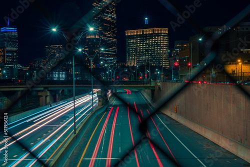Foto Long exposure of the Boston skyline and Interstate 90 light trails with views of
