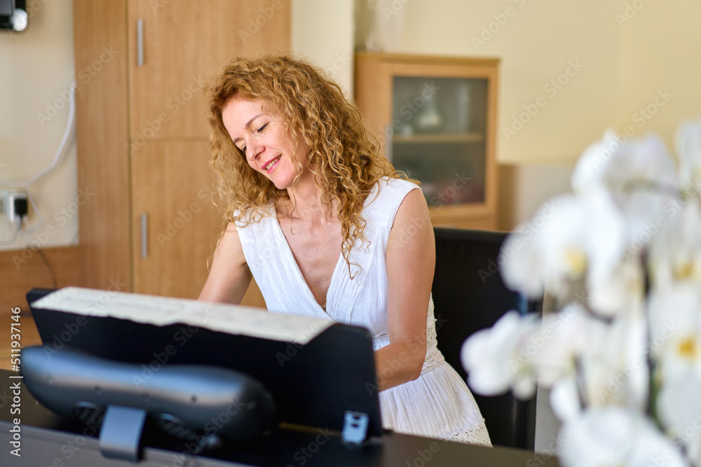 Woman in white dress sitting at the piano. Woman playing piano were digitally modified. Practice at home. Woman in white dress sitting at the piano. Woman playing piano were digitally modified. Practice at home.