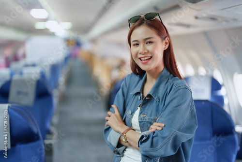 travel business Portrait of an Asian woman showing joy while waiting for a flight