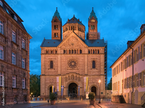 Speyer, Germany. West facade of Speyer Cathedral at sunset. The Imperial Cathedral Basilica of the Assumption and St Stephen was founded in 1030 and consecrated in 1061. photo