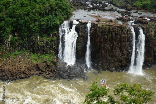 The photo shows a beautiful view of the Iguazu Falls, which are located on the border between Brazil and Argentina.