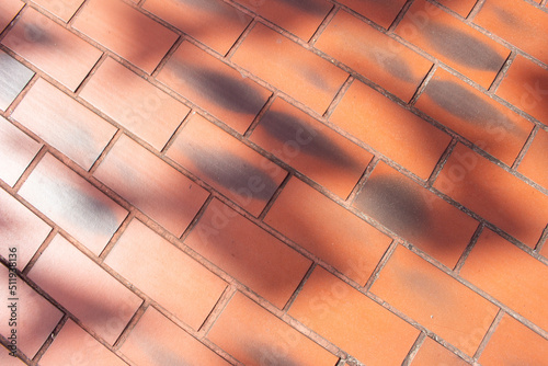 top view of beautiful brown brick texture on a sunny day