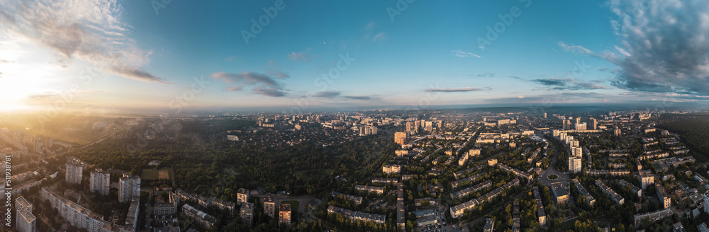 Sunny morning wide panorama in city residential district. Aerial colorful view above buildings and streets, Pavlovo Pole, Kharkiv Ukraine