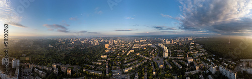 Sunny morning cityscape extra wide panorama in city residential district. Aerial colorful view above buildings and streets, Pavlovo Pole, Kharkiv Ukraine
