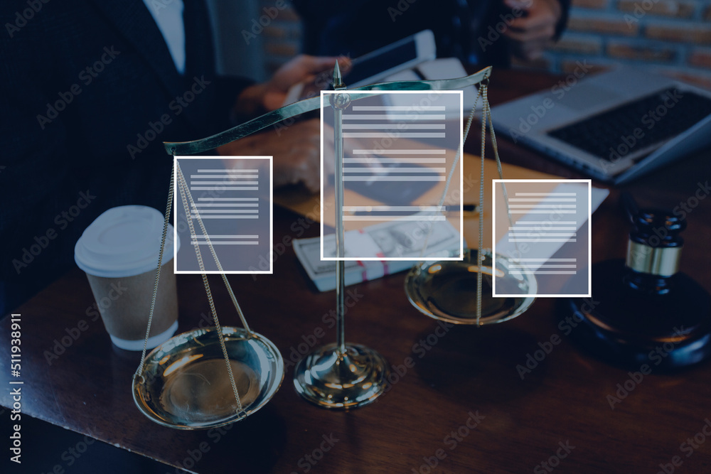 Naklejka premium Justice and law concept.Male judge in a courtroom with the gavel, working with, computer and docking keyboard, eyeglasses, on table in morning light