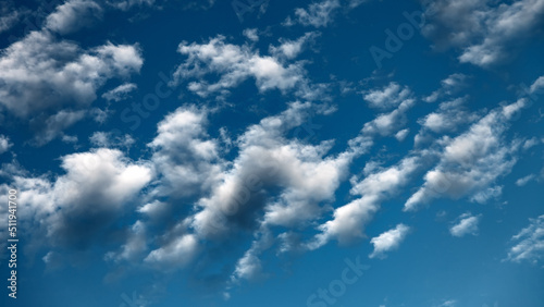 White clouds in the blue sky.