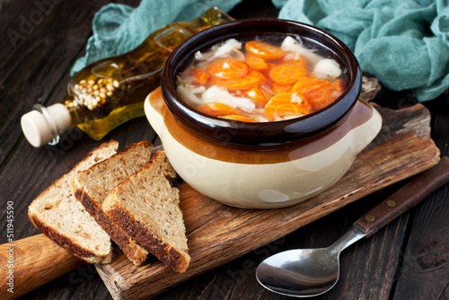Bowl of vegetable soup with rye bread