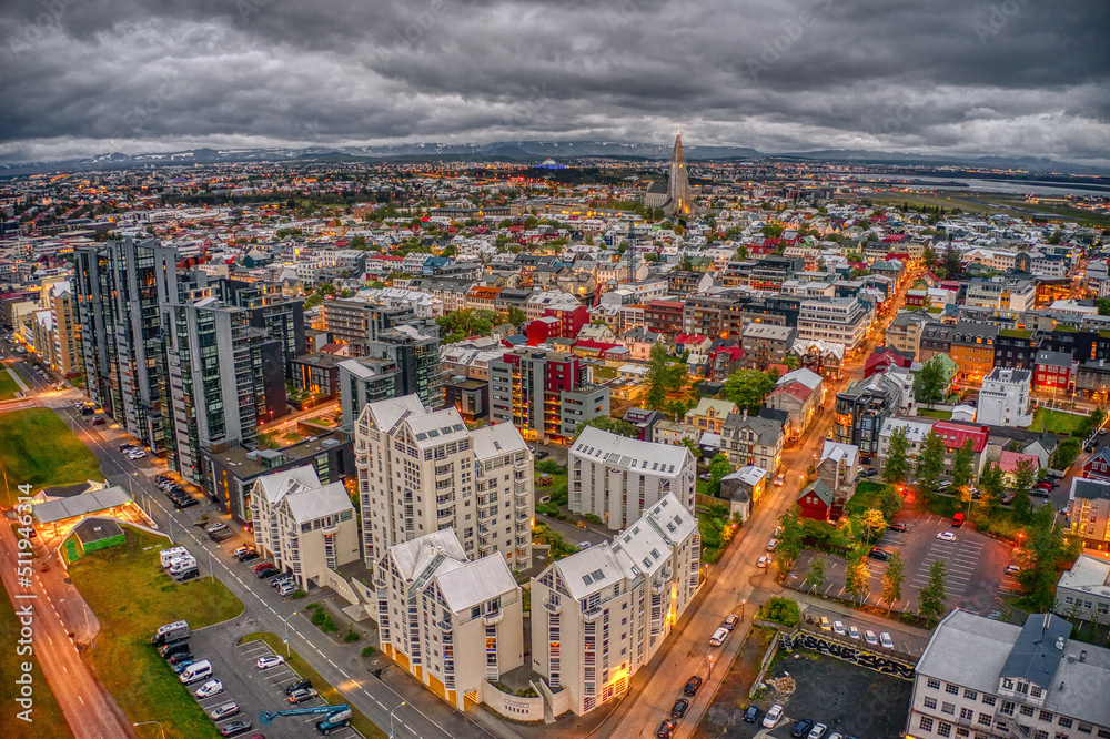Obraz premium Aerial View of the rapidly growing Urban Center of Reykjavik, Iceland at Night during Summer