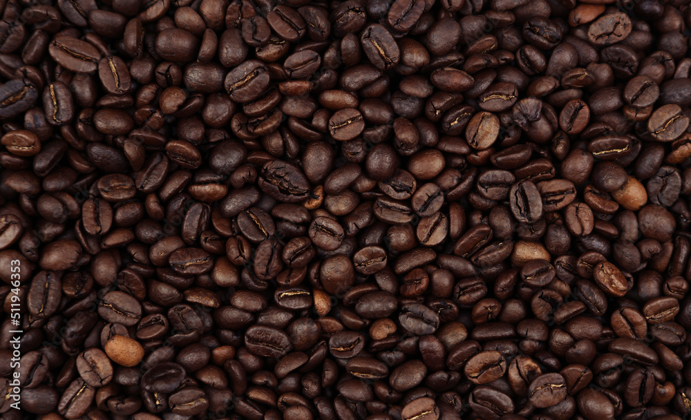 Close-up of roasted brown coffee beans background
Close-up of roasted brown coffee beans background