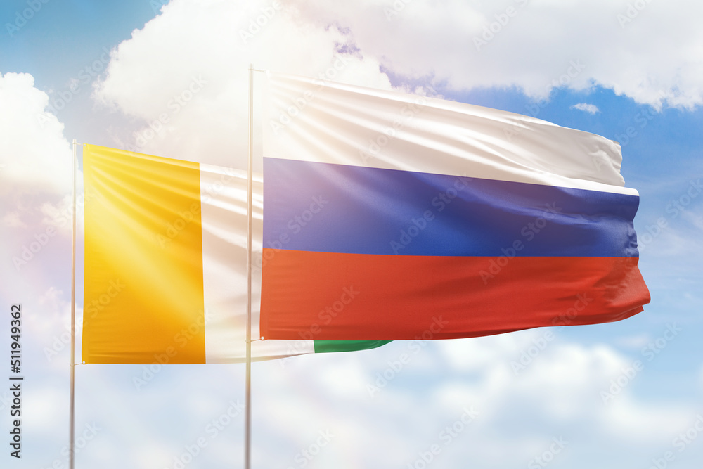 Sunny blue sky and flags of russia and ivory coast Sunny blue sky and flags of russia and ivory coast