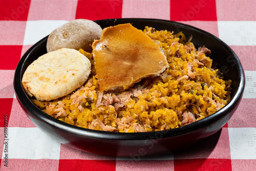 Typical tolimense lechona with rice - Typical Colombian dish photo