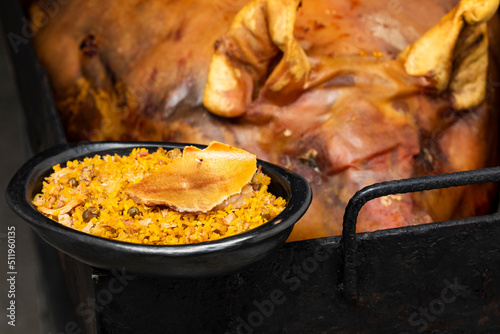 Suckling pig with rice, potato, arepa - Typical Colombian gastronomy