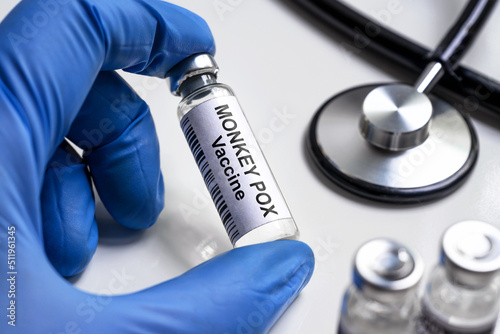 Monkey pox vaccine bottle in doctors hand photo