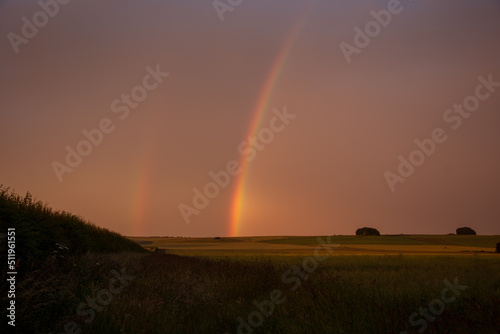 Rainbows over Avebury in Wiltshire. Summer solstice.