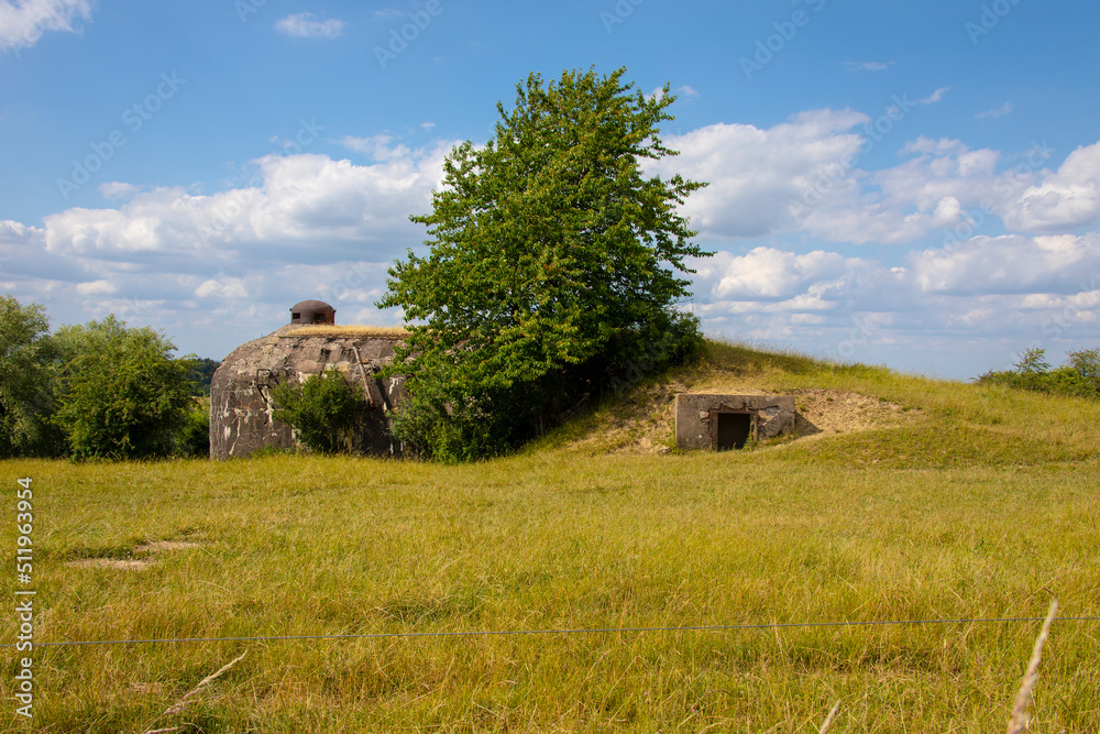 Old german bunker from the 2nd World War. A concrete bunker, abandoned in the fields in France. Old german bunker from the 2nd World War. A concrete bunker, abandoned in the fields in France.