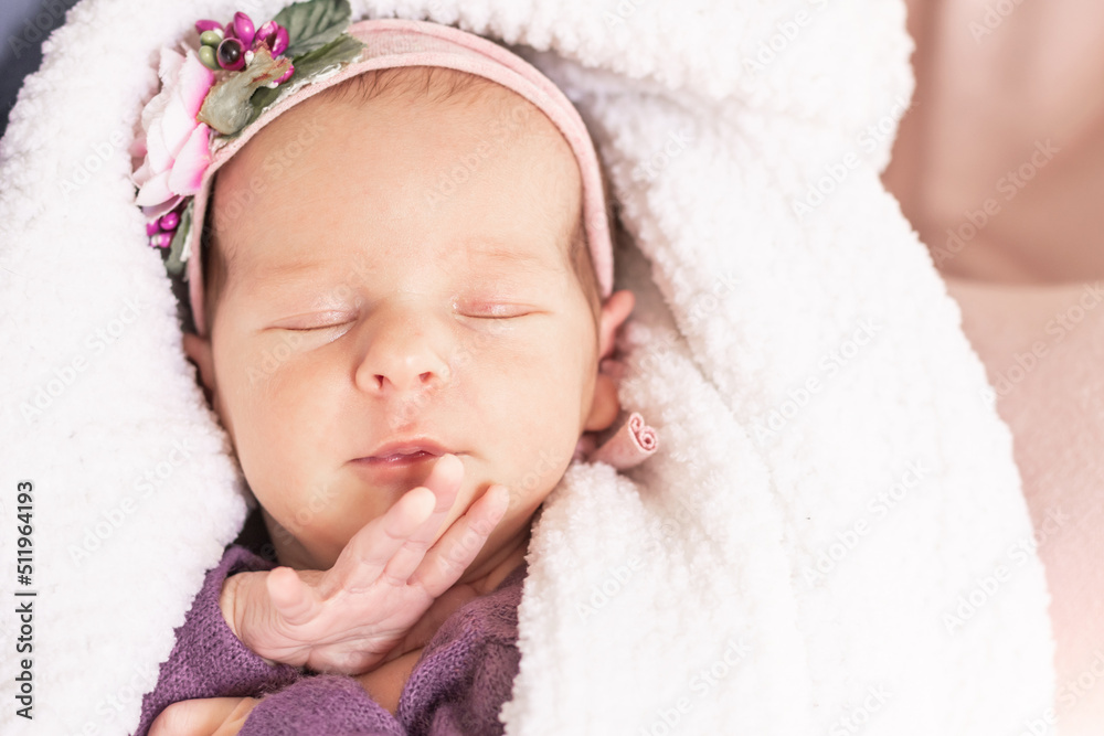 Sleeping newborn baby girl on a white fluffy soft blanket. First month Sleeping newborn baby girl on a white fluffy soft blanket. First month
