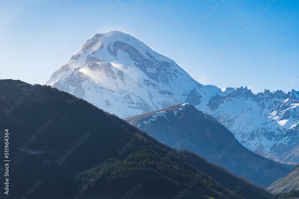 majestic shot of snowcapped mountain Mkinvartsveri, Kazbegi, Georgia. High quality photo