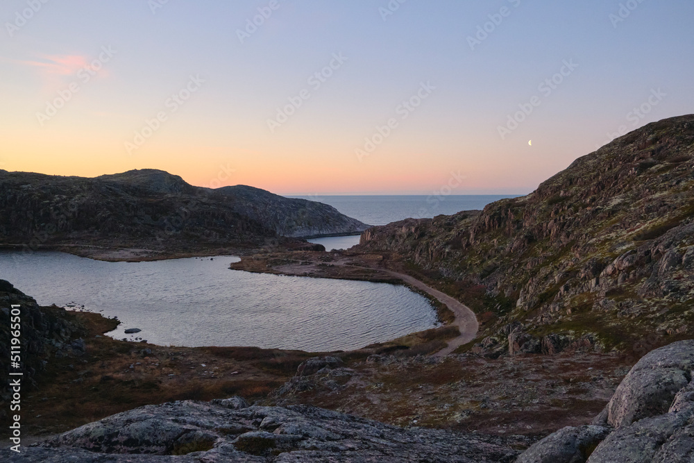 Fototapeta premium Lake in Teriberka in autumn. Colorful tundra landscape on the Kola Peninsula in autumn