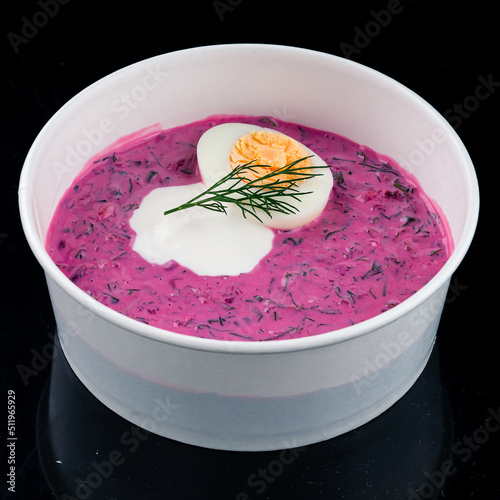 Vegan food, summer cold Beetroot soup with fresh herbs copy space top view photo