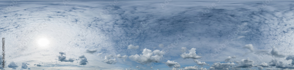 The sky is overcast with white thick clouds on a sunny day, beautiful thick clouds in the blue sky. Seamless panorama 360 degrees angle view blue sky with beautiful fluffy cumulus clouds with zenith