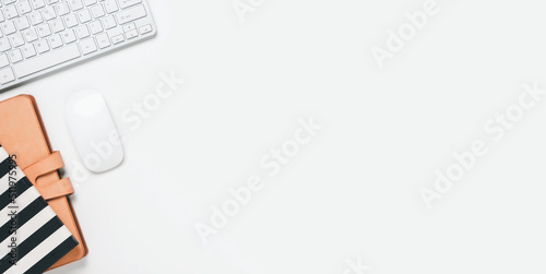 Tableau sur toile Top view, White office desk with keyboard, notebook and mouse, copy space, Mock up