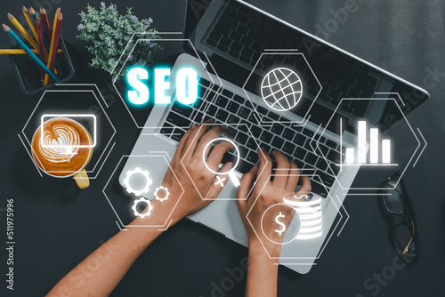 SEO Concept, Search Engine Optimization, Woman hand using laptop computer with VR screen seo icon, concept for promoting ranking traffic on website, optimizing your website to rank in search engines.