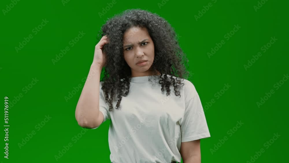 young woman looking to the camera showing confused expression Isolated on Green Screen young woman looking to the camera showing confused expression Isolated on Green Screen