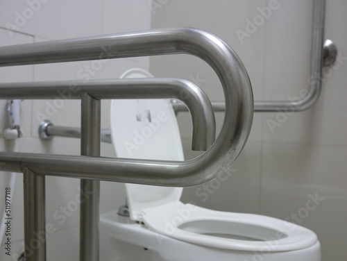 handicap handle for security in public toilet. 