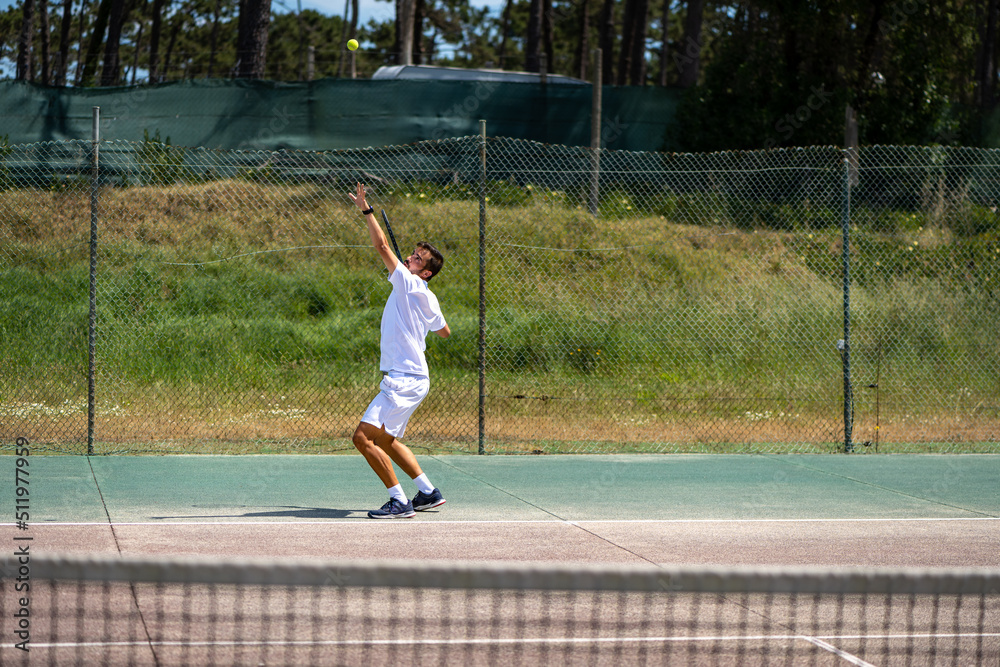 Tennis player performing a service