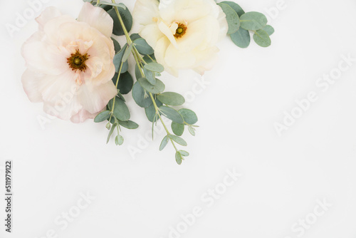 Beautiful floral flat lay with butterfly ranunculus with copy space