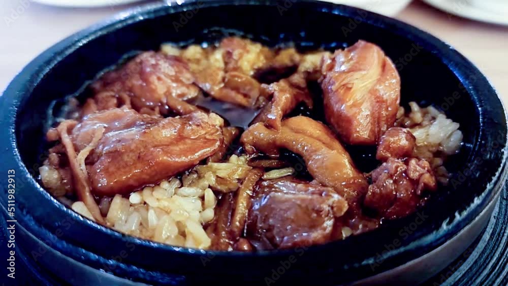Sesame oil chicken rice with mushroom. The chef cooked the dishes with boiling oil a lot of smoke. Sesame oil chicken rice with mushroom. The chef cooked the dishes with boiling oil a lot of smoke.