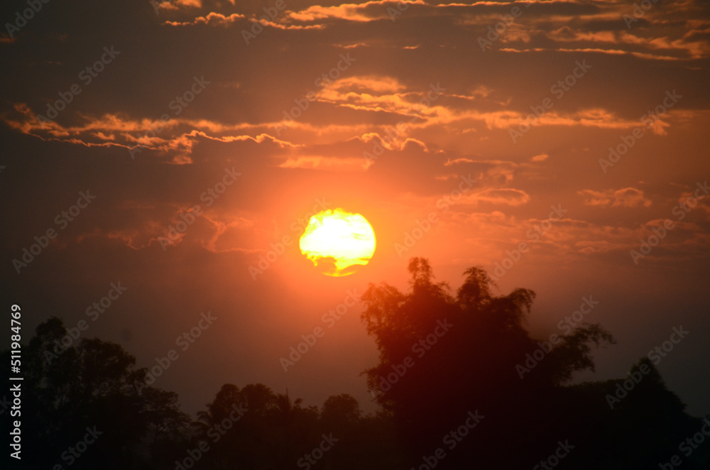 Obraz premium Scenic view dramatic beautiful sunset sky. Natural Sunset Sunrise on meadow silhouette shadow dark land. Vibrant dramatic sky on sunset, dawn, sunrise in Countryside. Landscape Colorful Sky At Sunset