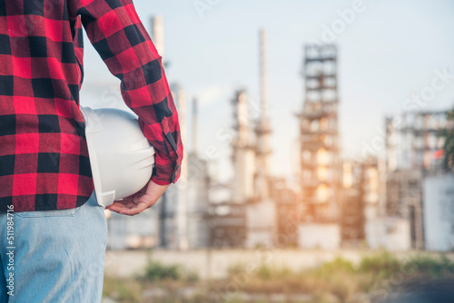 Engineer woman hands holding hardhat white work helmet hard hat for Construction Engineering. Refinery woman engineer oil industry hands hold worker helmet hard hat. Refinery industry engineering