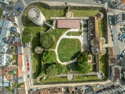 Aerial top down ground plan view of medieval Dourdan castle, square shape with eight towers including a stand alone circular donjon with drawbridge over the moat in Essone ile de France photo