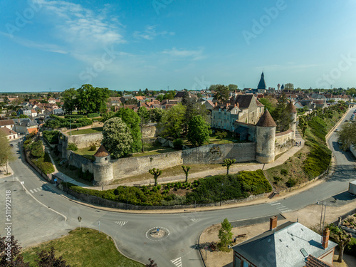 Aerial panoramic view of Dun sur Auron walled medieval town in central France with defensive circular towers and great bell tower