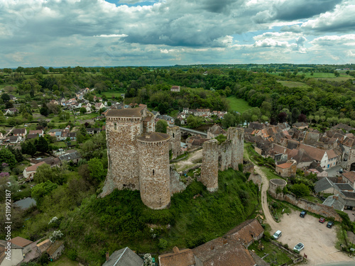Aerial view of the ruins of Herisson fortress of the Dukes of Bourbon dominate the medieval city of Hérisson and Aumance Valley with towers standing tall in the inner castle in central France