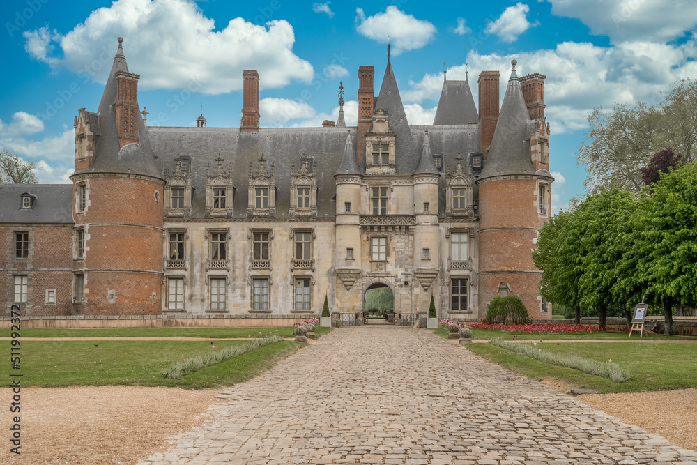 View of the Renaissance Maintenon castle in Eure et Loir France with imposing rectangular and circular towers and majestic garden. Principal corps de logis,flanked by three round towers